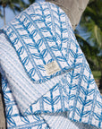 Gudri (reversible) Quilt Grecian Floral Logo Stripe in Aegean